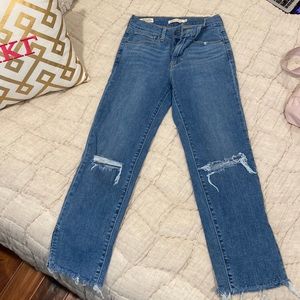Levi’s high rise straight jeans with rips in the knees cropped fit